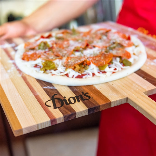 Each pizza board is unique and created using an assortment of woods including walnut, African mahogany, white maple, cherry, red oak, poplar, and cedar. 