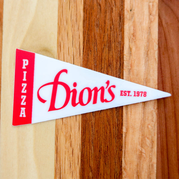 Add vintage flair with the Dion's Pennant Sticker from Dion's Fan Shop—featuring “Dion’s Pizza EST. 1978” in bold red on a classic triangular pennant. Perfect 1978 swag for your laptop or to decorate any wood surface.
