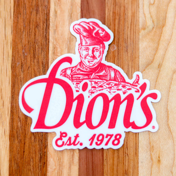 The Dion's Pizza Man Sticker from Dion's Fan Shop features a chef holding a pizza with “Dion’s Est. 1978” in red on a wood background—a must-have collectible for Dion’s fans.