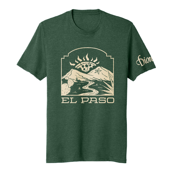 The El Paso Tee by Dion's Fan Shop features a green design with a mountain, sun, and river graphic inspired by the Franklin Mountains. "El Paso" is on the front and "Dion" appears on the sleeve for a special detail.